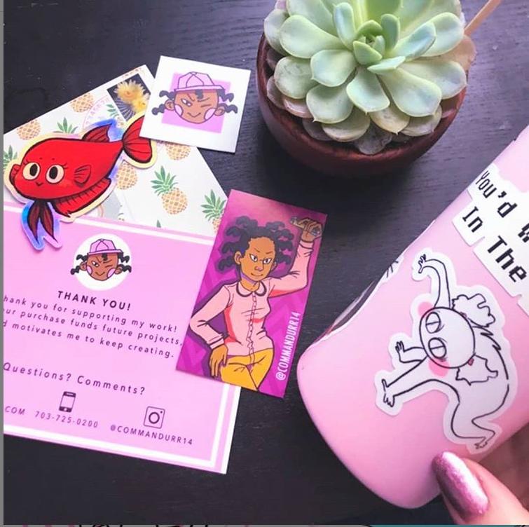 Image of the Hotto choccy Sticker, Tea and Lee Mini print, Cute yet spookie sticker pack, and the precious smirk button pin on a pink and blue background. 